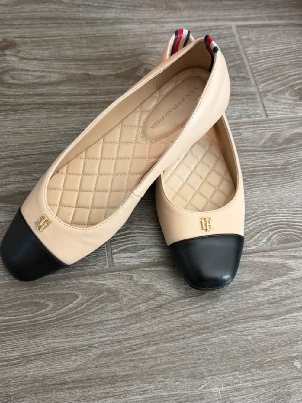 Tommy Hilfiger Beige Ballet Flats with Black Cap Toe and Gold Logo